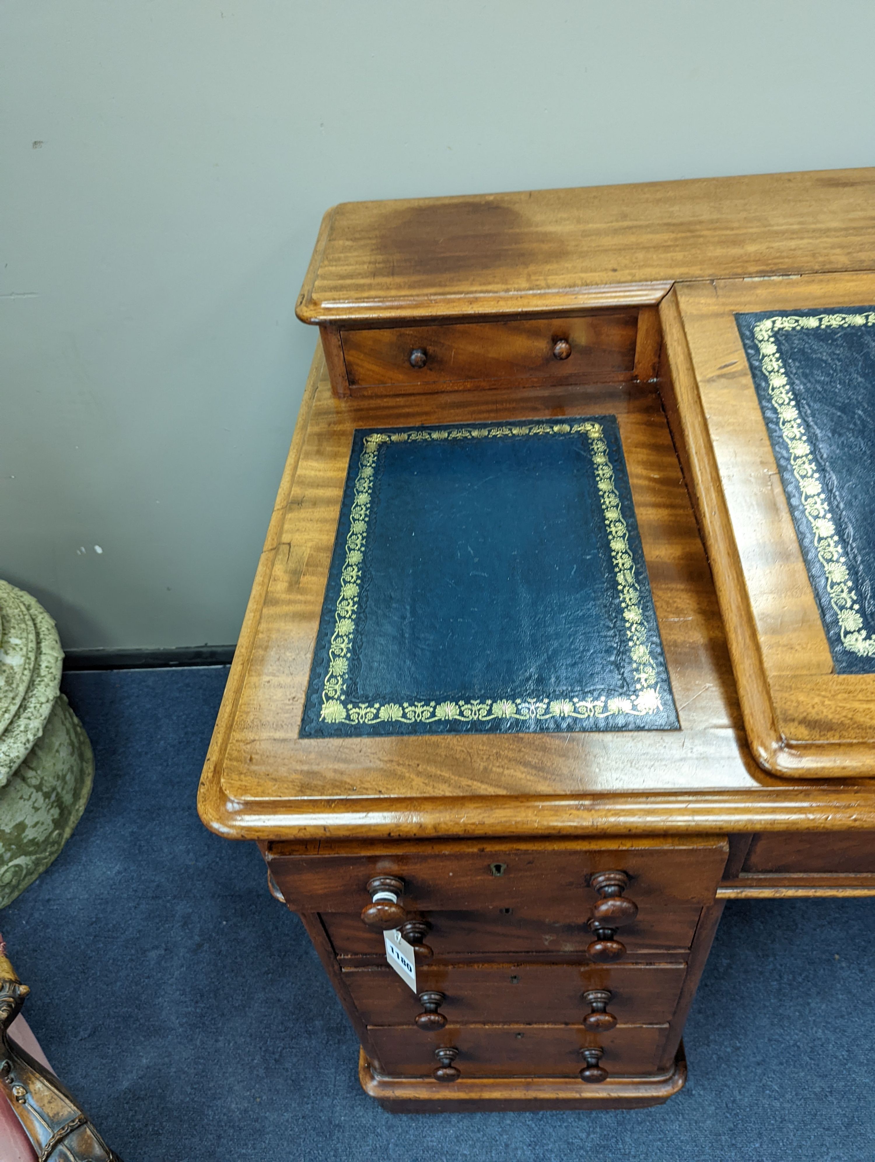 A Victorian ‘Dickens’ mahogany pedestal desk, width 137cm, height 87cm